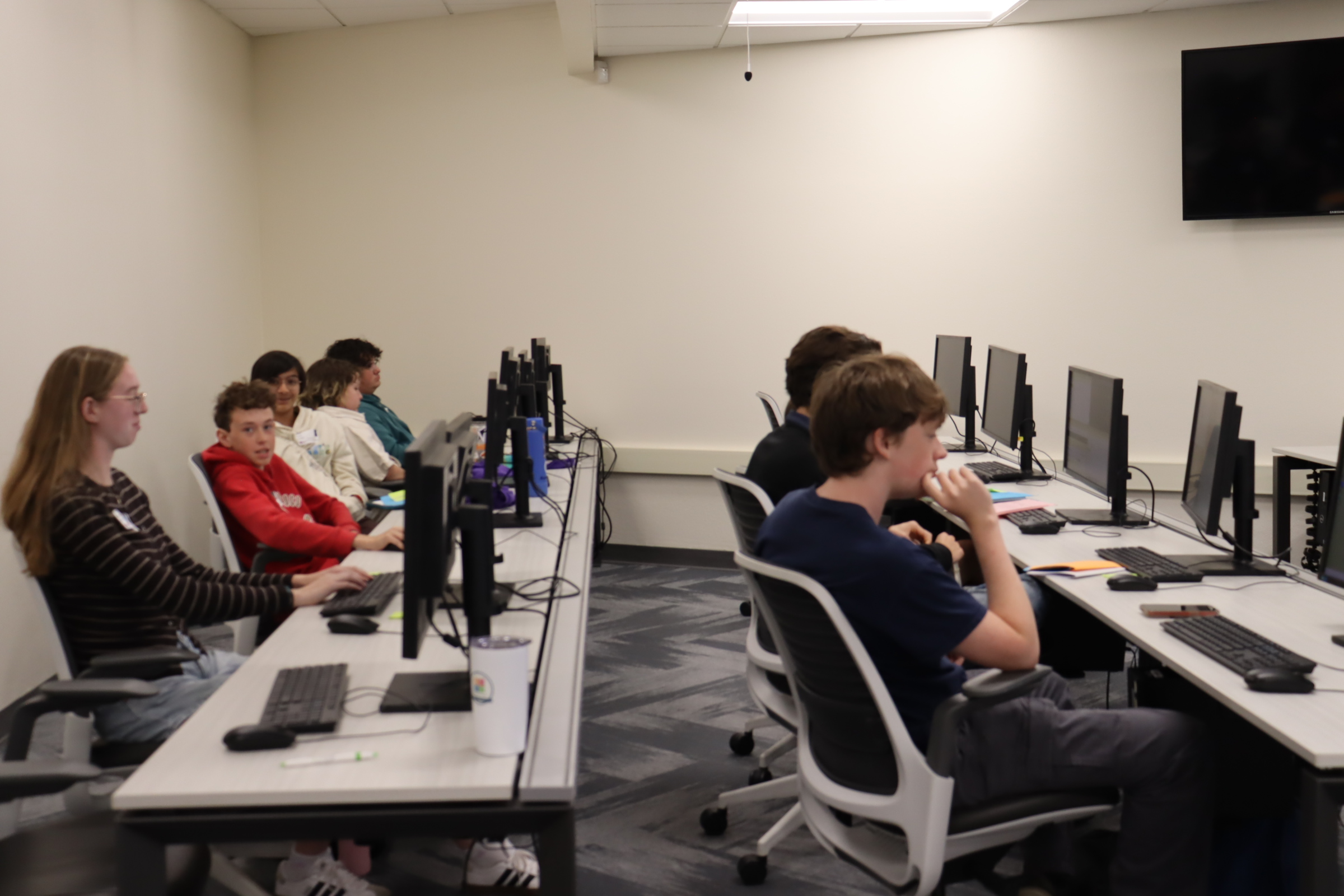 Students working at desktop computers during a Kickoff class